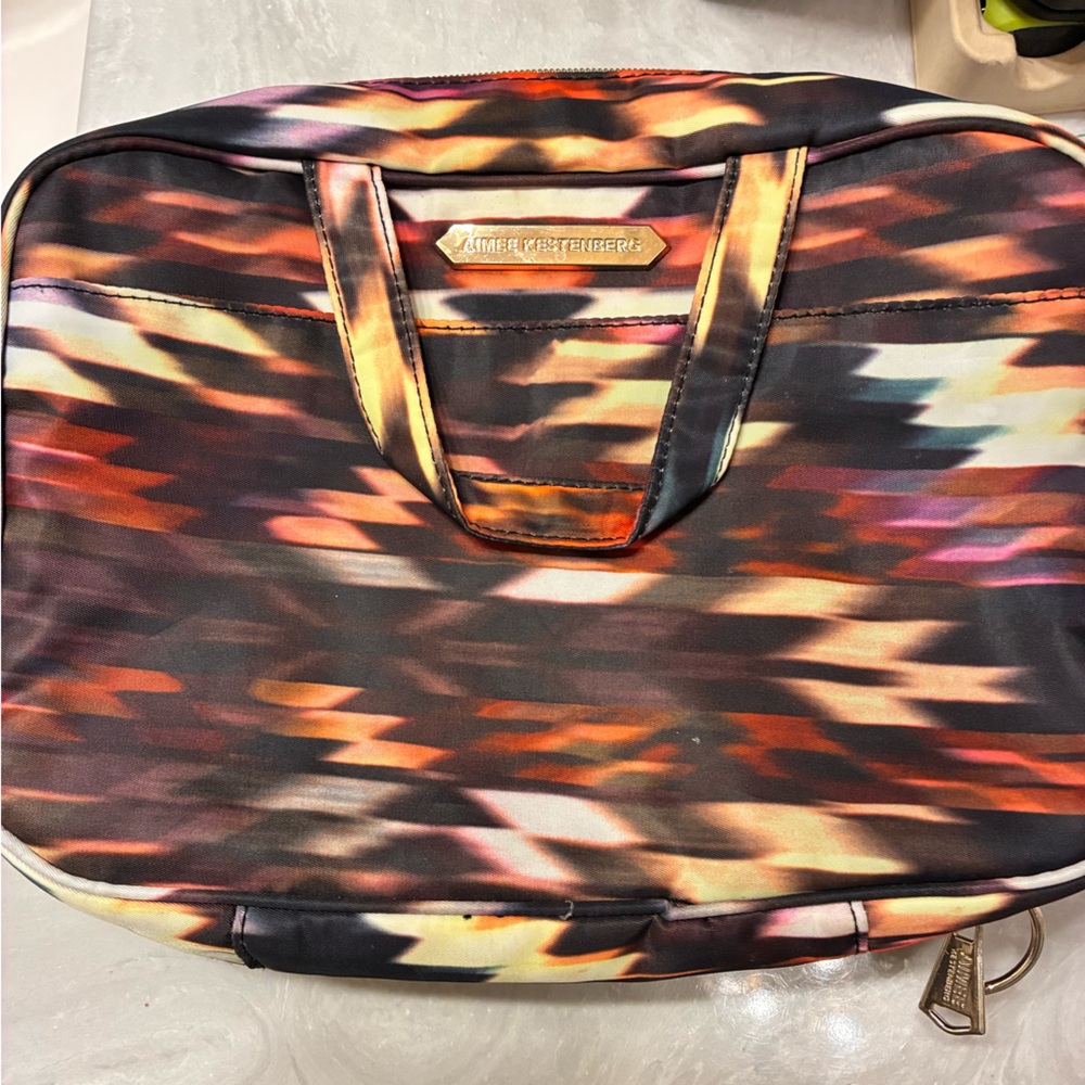 Aimee Kestenberg
Black and Gold make up bag